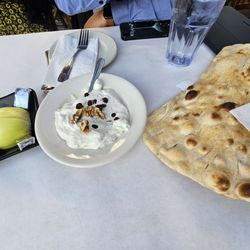 Safir Mediterranean Cuisine - Bread and tzatziki sauce, with an onion!!