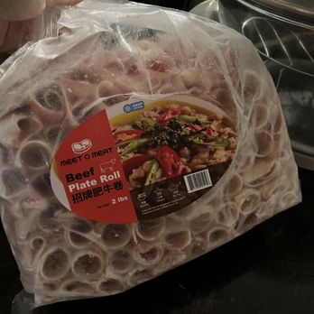 Meet O Meat - a person holding a bag of meat - Meat Shops Near Me - Burnaby, British Columbia Meet O Meat - a person holding a bag of meat - Meat Shops Near Me - Burnaby, British Columbia