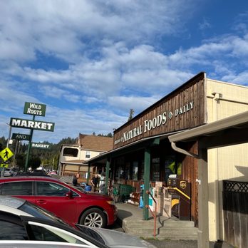 Wild Roots Market - a woman walking in front of the store - Organic Stores Near Me - Felton, California Wild Roots Market - a woman walking in front of the store - Organic Stores Near Me - Felton, California