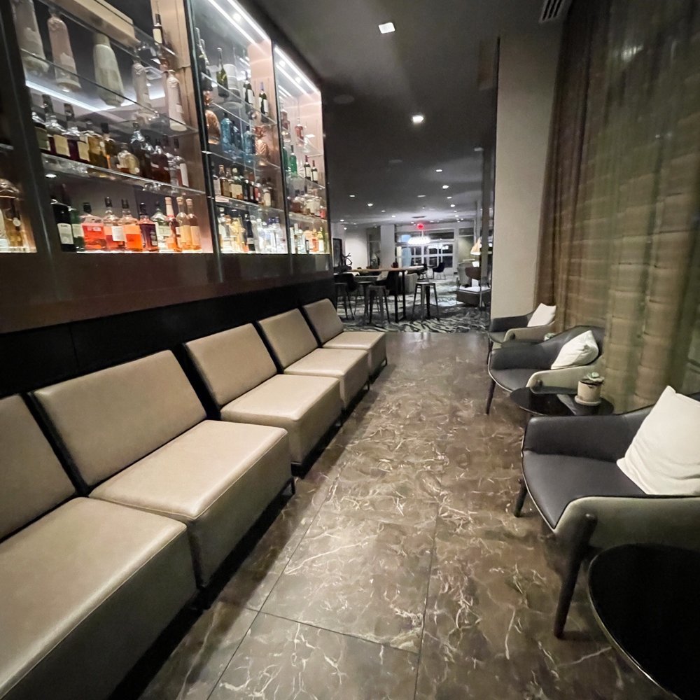 AC Hotel by Marriott Gainesville Downtown - Lounge behind the bar - Hotels Near Me - Gainesville, Florida AC Hotel by Marriott Gainesville Downtown - Lounge behind the bar - Hotels Near Me - Gainesville, Florida