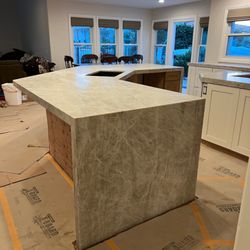 Stonesmith Countertops - Taj Mahal large island w/ waterfalls