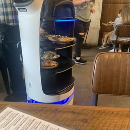 "Bella," the robot server