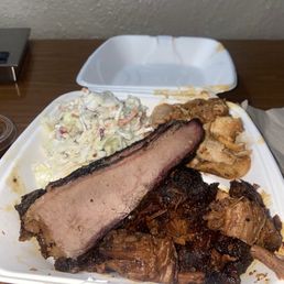 three meat plate with slaw.