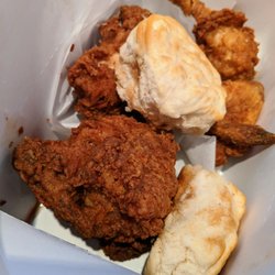 KFC - Close-up of dinner for two box that includes five pieces of chicken and two biscuits. Four sides included, but not pictured.