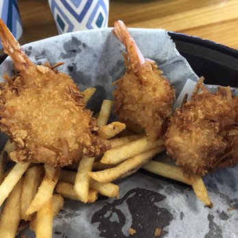 Coconuts Fish Cafe - 1/2 way through meal took pic. This is their amazing coconut shrimp!!! Hubby & I shared the fries - Seafood Near Me - Kihei, Hawaii Coconuts Fish Cafe - 1/2 way through meal took pic. This is their amazing coconut shrimp!!! Hubby & I shared the fries - Seafood Near Me - Kihei, Hawaii