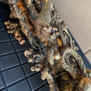 Andrea Smith Gallery Sedona - Broken brass piece from idol lying inside the trunk of our SUV along with the idol - Art Galleries Near Me - Sedona, Arizona Andrea Smith Gallery Sedona - Broken brass piece from idol lying inside the trunk of our SUV along with the idol - Art Galleries Near Me - Sedona, Arizona