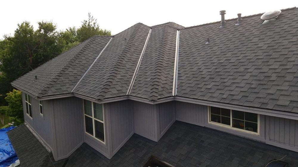 Slide of Cowtown Roofing