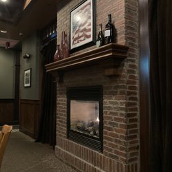 Nick and Jake's - Cozy fireplace in dining room