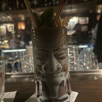 The Vine Room - a tiki glass with straws in it - Speakeasies Near Me - Naples, Florida The Vine Room - a tiki glass with straws in it - Speakeasies Near Me - Naples, Florida