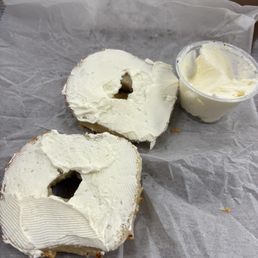 Toasted Asiago bagel with cream cheese on the side Toasted Asiago bagel with cream cheese on the side