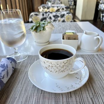 Greenfinch Restaurant - a cup of coffee and a glass of water - New American Near Me - La Jolla, California