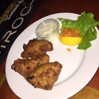Footprints Cafe - Codfish fritters with a side of tartar sauce - Bars Near Me - Brooklyn, New York Footprints Cafe - Codfish fritters with a side of tartar sauce - Bars Near Me - Brooklyn, New York