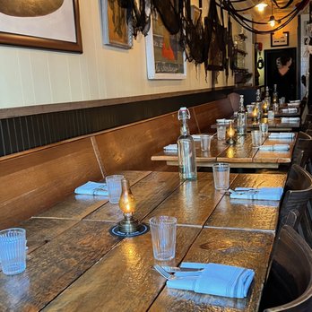 The Heron - a long wooden table with place settings - New American Near Me - Narrowsburg, New York