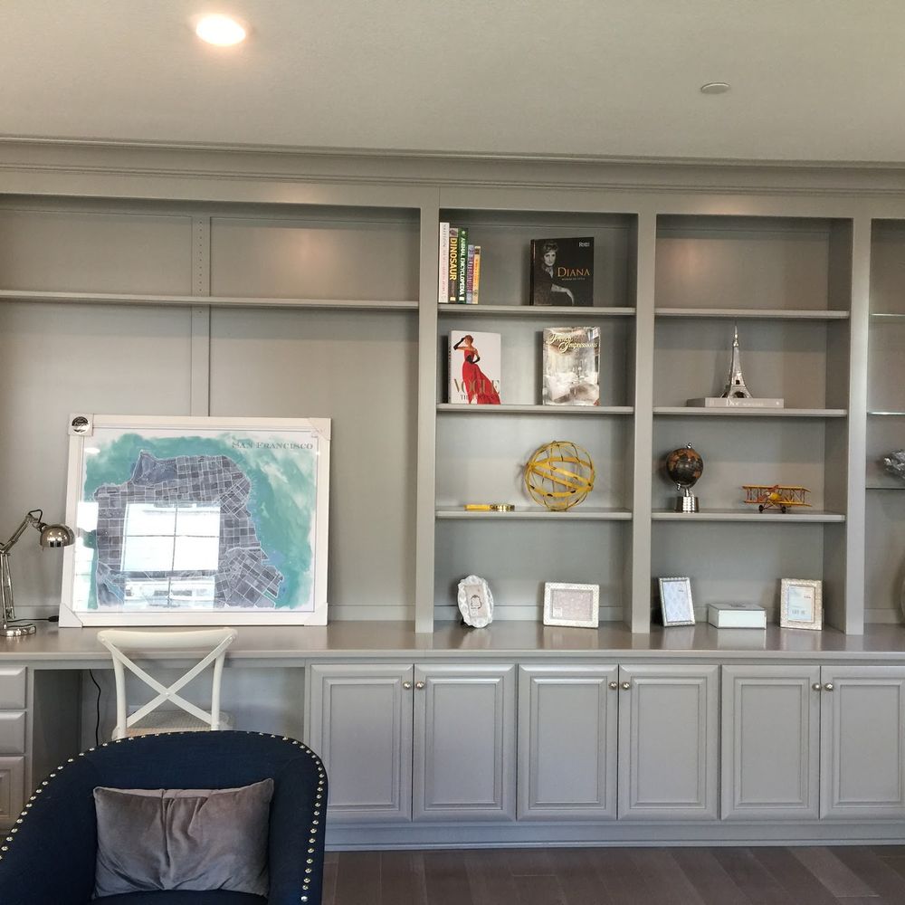 a living room with built in bookcases