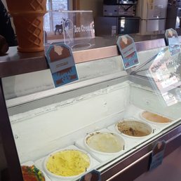 a variety of ice creams in a display case
