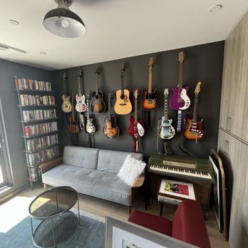 J Greene - 12 Guitar mounts meticulously installed in this artists music room. - Handyman Near Me J Greene - 12 Guitar mounts meticulously installed in this artists music room. - Handyman Near Me