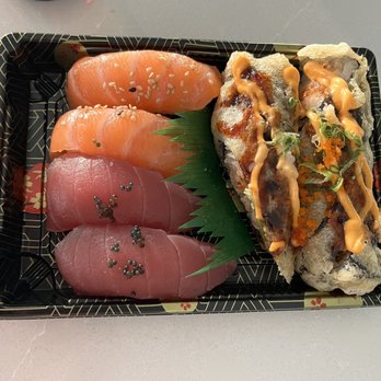 Shoyu Sushi - Salmon (shake) sushi top left, Tuna (maguro) sushi bottom left, Lucky Seven Roll left - Sushi Bars Near Me - Parker, Colorado Shoyu Sushi - Salmon (shake) sushi top left, Tuna (maguro) sushi bottom left, Lucky Seven Roll left - Sushi Bars Near Me - Parker, Colorado