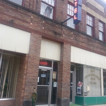 Ryan Hotel - The little wooden doorman in front welcomes you to a time from the past. - Hotels Near Me - Wallace, Idaho