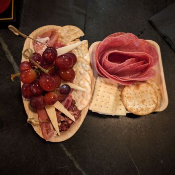 The Eastman - a platter of meat, cheese and grapes - Speakeasies Near Me - Rochester, Michigan The Eastman - a platter of meat, cheese and grapes - Speakeasies Near Me - Rochester, Michigan