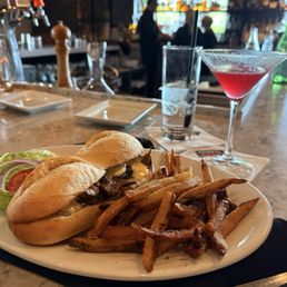 Mhappy hour steak sandwich, and martini Mhappy hour steak sandwich, and martini
