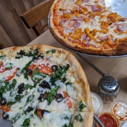 Greek pizza and buffalo chicken pizza