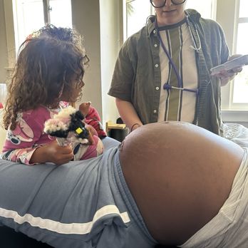 Long Beach Midwife - Everyone listening to baby's heartbeat during our prenatal visit. - Midwives Near Me Long Beach Midwife - Everyone listening to baby's heartbeat during our prenatal visit. - Midwives Near Me