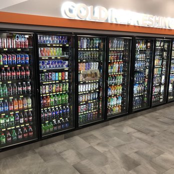 TRIO - a row of coolers in a grocery store - Pizza Near Me - North Chicago, Illinois TRIO - a row of coolers in a grocery store - Pizza Near Me - North Chicago, Illinois