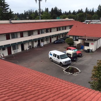 Ace Construction Pro - Tile roof re-finished at KE Motor Inn in Edmond - Roofing Near Me - Puyallup, Washington Ace Construction Pro - Tile roof re-finished at KE Motor Inn in Edmond - Roofing Near Me - Puyallup, Washington