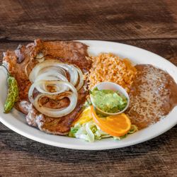Taqueria Zapotlanejo - Carne Asada Plate - grilled, seasoned diezmillo with grilled onions & serrano pepper. Served with guacamole & warm corn or flour tortillas.