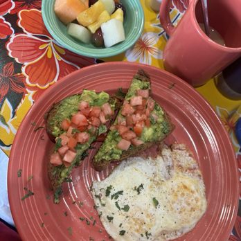 The Flying Biscuit Cafe - Avo toast, I asked the kitchen to add cilantro. Over easy egg and fruit. - New American Near Me - Charlotte, North Carolina The Flying Biscuit Cafe - Avo toast, I asked the kitchen to add cilantro. Over easy egg and fruit. - New American Near Me - Charlotte, North Carolina