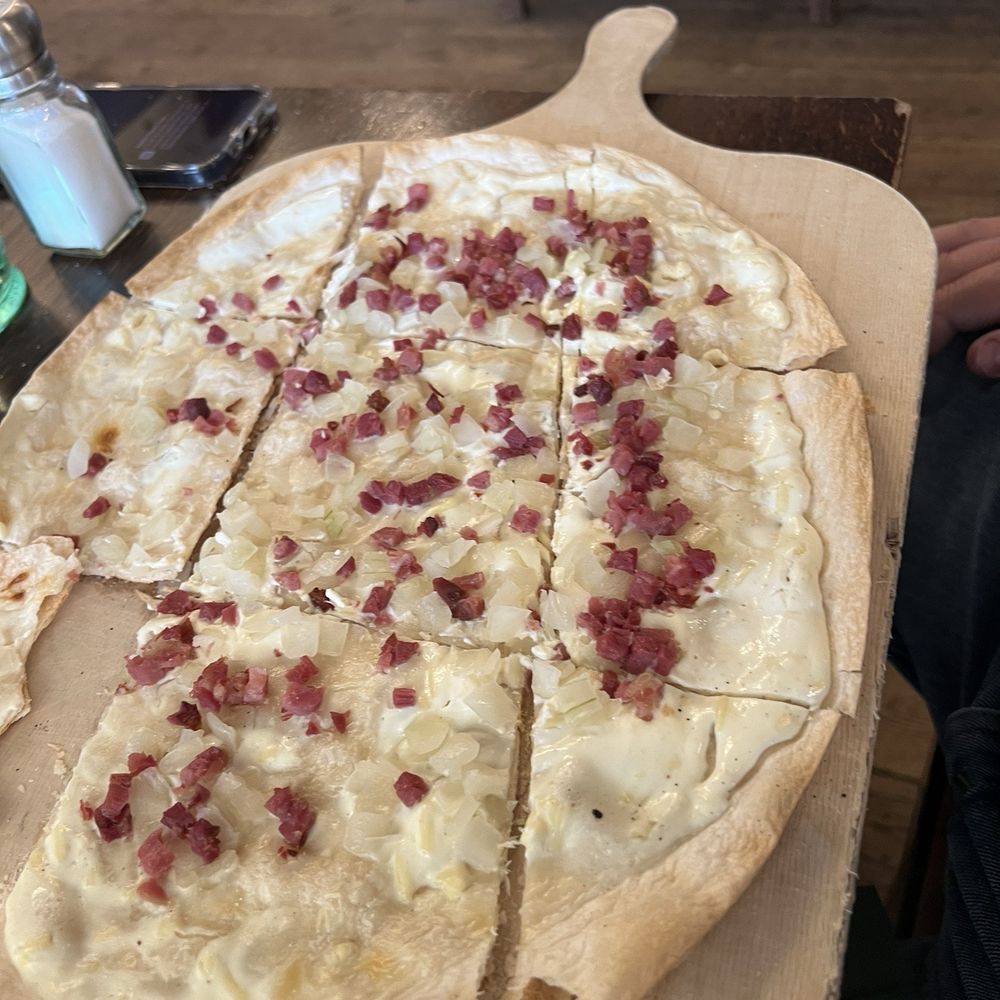 Bitburger Wirtshaus - Flammkuchen.  This crust with a sour cream sauce and bacon and onions - Beer Garden Near Me - Trier, RP