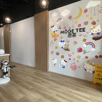 Moge Tee - a barber chair in front of a wall mural - Bubble Tea Near Me - Markham, Ontario