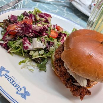 Stateside Kitchen - Hot chicken sandwich with the fries swapped for salad - New American Near Me - Nashville, Tennessee Stateside Kitchen - Hot chicken sandwich with the fries swapped for salad - New American Near Me - Nashville, Tennessee