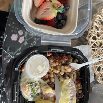 Devoted Kiss Cafe - Eggs Benedict and hash with a side of fruit. - Breakfast & Brunch Near Me - Gig Harbor, Washington