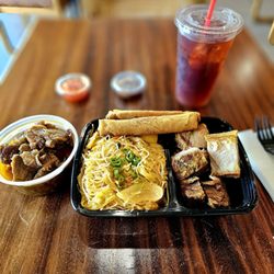 Sarap Filipino BBQ & Grill - From left to right....pineapple pork, pancit, pork lumping and lechon kawali.