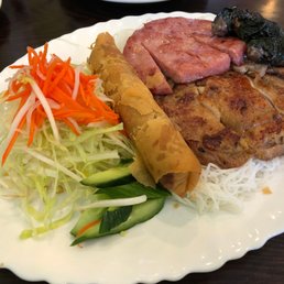 spring roll, pork patty, betal leaf and grilled chicken on vermicelli spring roll, pork patty, betal leaf and grilled chicken on vermicelli