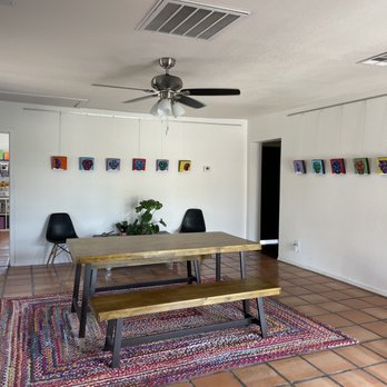 Palabras Bilingual Bookstore - a dining table and benches - Bookstores Near Me - Phoenix, Arizona