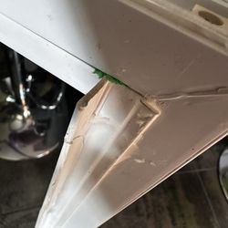 Brightview Glass Replacement - Close-up showing silicone applied over the damaged frame