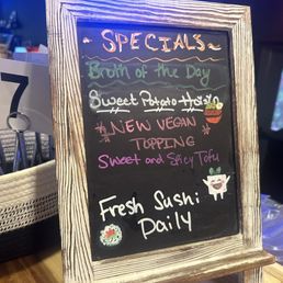 a chalk board with a menu on it a chalk board with a menu on it