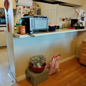 Isamu Construction - a kitchen with a microwave on the counter - General Contractors Near Me - Mililani, Hawaii