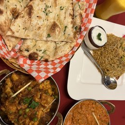 Garlic naan, shrimp briyani, aloo gobi, chicken masala, mango lassi