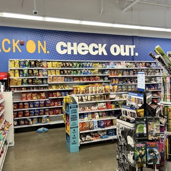 Five Below - Inside Five Below in Nanuet, NY, snack shelves are visible beneath a large sign that says 'CHECK OUT.' The store features organized snack displays and a merchandise rack. - Accessories Near Me - Nanuet, New York