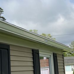 New England Improvements - 6" seamless gutters properly pitched.