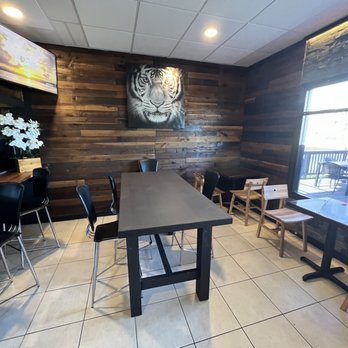 Korean BBQ - a table and chairs in a restaurant - Korean Near Me - Pinellas Park, Florida Korean BBQ - a table and chairs in a restaurant - Korean Near Me - Pinellas Park, Florida