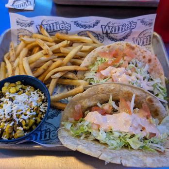 Willie's Grill & Icehouse - Hamburgers in tortillas instead of buns. 2 sides included. - American Near Me - Houston, Texas Willie's Grill & Icehouse - Hamburgers in tortillas instead of buns. 2 sides included. - American Near Me - Houston, Texas