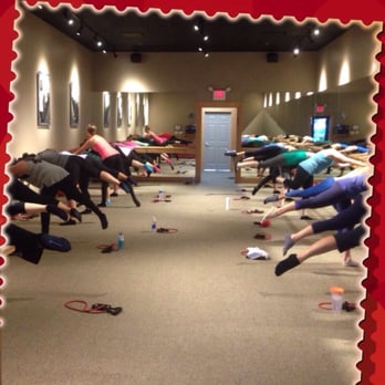 Pure Barre - Doing seat work at the barre during a Tuesday 6pm class! Probably the busiest one available. - Barre Classes Near Me - Orlando, Florida