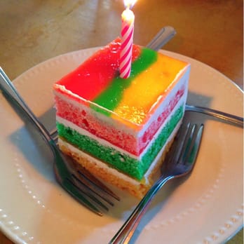 Kona Kitchen - Seattle - Slice of rainbow cake ($3) - from the Cakes of Paradise bakery - Hawaiian Near Me - Seattle, Washington Kona Kitchen - Seattle - Slice of rainbow cake ($3) - from the Cakes of Paradise bakery - Hawaiian Near Me - Seattle, Washington