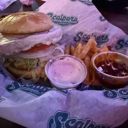 Turkey Burger topped w/ lettuce, tomato, onions, mayo on a Brioche bun Turkey Burger topped w/ lettuce, tomato, onions, mayo on a Brioche bun
