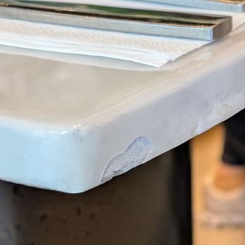 15th Ave Cafe & Bistro - Chipped table. This restaurant is 3 weeks old. - Cafes Near Me - Markham, Ontario