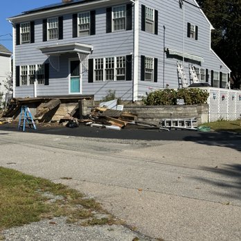 Herrera Construction - Paint job completed and work started on dismantling and rebuilding front porch. - Carpenters Near Me